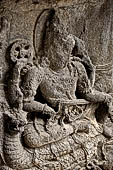 Prambanan - Ramayana reliefs on inside of balustrade of Shiva temple. Here is Vishnu, enthroned on Ananta, the serpent, (scene 1, middle).  